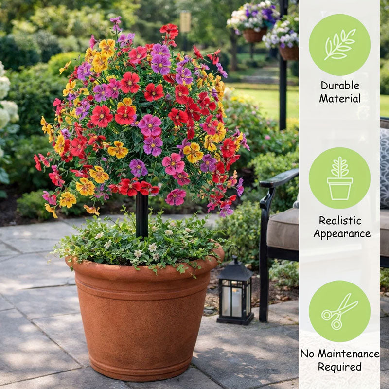 Blomsterdekorasjon med kunstig eukalyptus og fiol i bakken