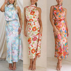 Ermeløs knytehalstrykk i sateng med halterneck og elastisk midje og maxikjole