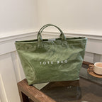 Toteveske med bokstavtrykk for kvinner
