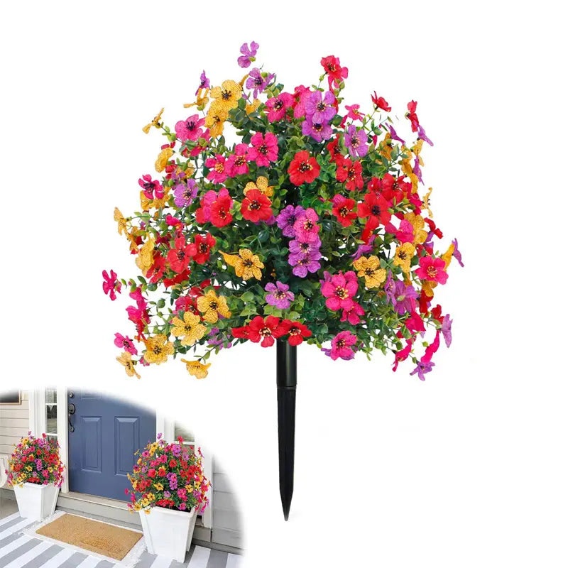 Blomsterdekorasjon med kunstig eukalyptus og fiol i bakken